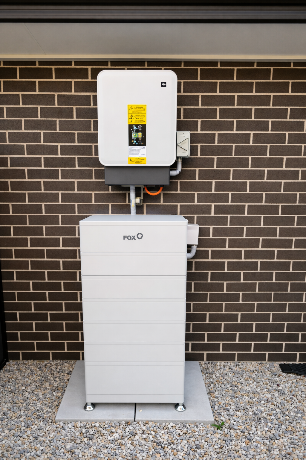 Fox ESS residential energy storage system installation with battery storage and hybrid inverters.